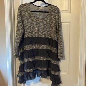 Thin, light Sweater type tunic. Black and gray and white with grey ruffles.